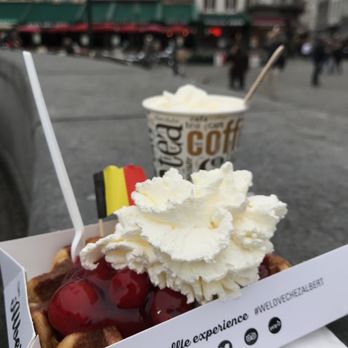 Chez Albert - Leige waffle topped with cherries and chantilly cream with a dark hot chocolate. - Waffles Near Me - Bruges, VWV Chez Albert - Leige waffle topped with cherries and chantilly cream with a dark hot chocolate. - Waffles Near Me - Bruges, VWV