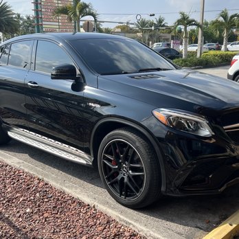 Doral Tinting - An exterior view on a sunny afternoon. The tints keep the car cooler and protect the interior. - Car Window Tinting Near Me - Miami, Florida