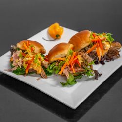 Exotic Burger - Our slowly roasted pork, mounted on mini butter rolls, drizzle of  chipotle aioli, &  topped with the Kreol spicy pikliz are lit!!