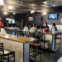 Lucy's Bar and Grill - The other half of the dining room. There is a poker table, a pool table, and a stage for a live band.
