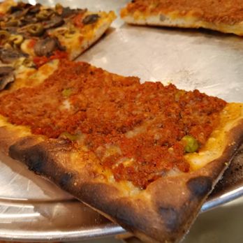 BKLYN Pizza - three slices of pizza on a pizza pan - Italian Near Me - Queens, New York BKLYN Pizza - three slices of pizza on a pizza pan - Italian Near Me - Queens, New York
