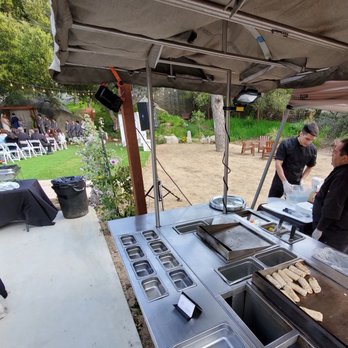 Temecula Creek Cottages - SOHOTACO.com preparing dinner quietly during the wedding ceremony at Temecula Creek Cottages. - Vacation Rentals Near Me - Temecula, California