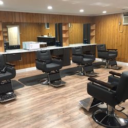 Groom Lounge Barbershop - The completed Groom Lounge main floor.services include :Haircuts, straight razor shaves, shampoos, manicures,facials and ear/eyebrow waxing.