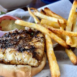 Uptown Raw Bar & Grill - Blackened Grouper sandwich and crispy fries