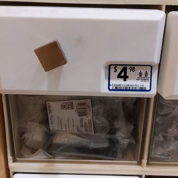 Lowe's Home Improvement - Mislabeled bin.  You can clearly see that the drawer pull is a nob while pulls in the bin are handles. - Hardware Stores Near Me - Belleville, Illinois