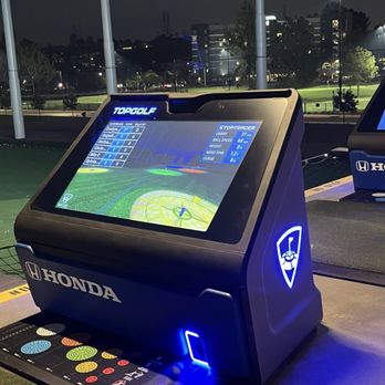 Topgolf - Additional screen for player to watch their move and game screen. The ball is retrieved by the motion sensor - Golf Near Me - Montebello, California