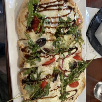 Olive Tree Diner - Flatbread, black olives, cheery tomato, arugula with balsamic reduction - Desserts Near Me - Mocksville, North Carolina Olive Tree Diner - Flatbread, black olives, cheery tomato, arugula with balsamic reduction - Desserts Near Me - Mocksville, North Carolina