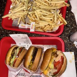 Burger, grilled cheese animal style on right, fries