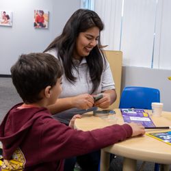 Behavior Frontiers Autism Center - A Behavior Frontiers behavior analyst works 1:1 with a child at our Riverside ABA clinic.