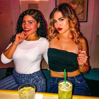 Lazy Point - two women sitting at a bar - Cocktail Bars Near Me - New York, New York