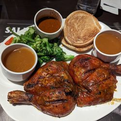 Rôtisserie St-Hubert - Two drumsticks with yummy Indian sauces.