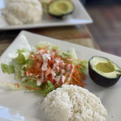 Mi Tierra Restaurant & Bakery - Rice , salad and avocado.