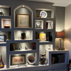 Extra Mile Builders - Built custom built-in shelves with outlets, lighting, and switches