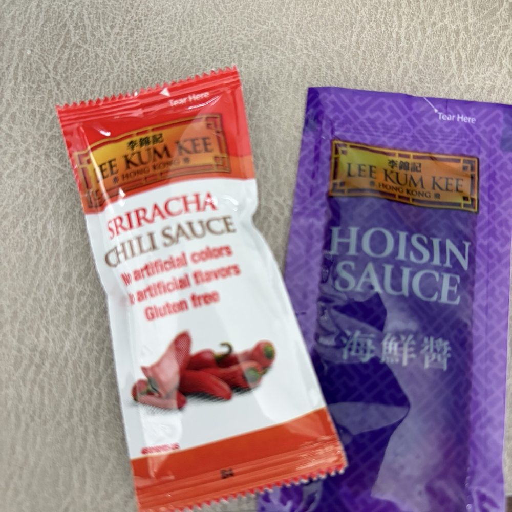 The sauces that come with their spring rolls take out orders. Not pictured here is their chili oil which comes in a 2 oz container.