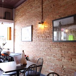 Cool motorcycle by the windows.