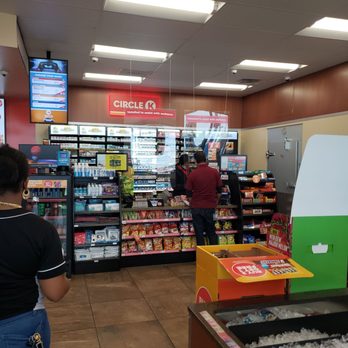 Circle K - a woman standing in a grocery store - Gas Stations Near Me - San Antonio, Texas