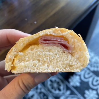 The Donut Run - a hand holding a half eaten donut - Donuts Near Me - Spanish Fork, Utah The Donut Run - a hand holding a half eaten donut - Donuts Near Me - Spanish Fork, Utah