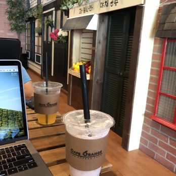 Cafe Orange - Such a cute wall ft. passion fruit tea and strawberry yogurt (very yummy!) - Desserts Near Me - Garden Grove, California