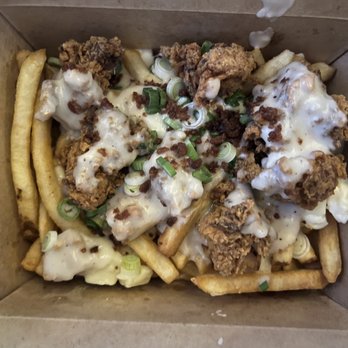 The Kroft - country fried chicken poutine: country sauce gravy, bacon, chicken nuggets, cheese curds, green onions = $10 - Poutineries Near Me - Long Beach, California The Kroft - country fried chicken poutine: country sauce gravy, bacon, chicken nuggets, cheese curds, green onions = $10 - Poutineries Near Me - Long Beach, California