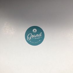 Grand Donuts Cafe & Bakery - Their logo