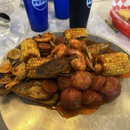 Sausage, clams, mussels, and shrimp. Sausage, clams, mussels, and shrimp.