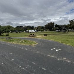 North Beach Campground - Camping spots are mostly pull through and on each side of the road with large grass fields in between for ample space.
