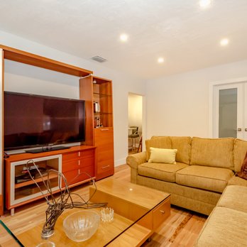 Unique Construction - Fully remodeled living room area with elegant lighitng to really give the room a nice touch! - General Contractors Near Me - Miami, Florida