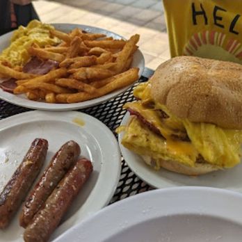 NY Deli - BEC on a roll, side of sausages, fries, scrambled eggs and bacon - Delis Near Me - Fort Lauderdale, Florida