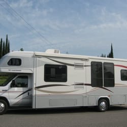 SLEEPS 4 ADULTS & 4 CHILDREN. Features Include: 2 Slide-Outs, Private Bedroom With a Walk-Around Queen Bed, Dinette Bed, cab bed