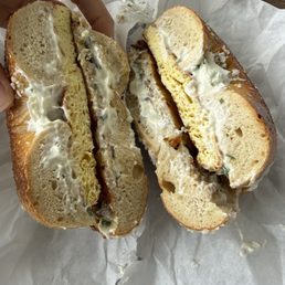 Salt bagel with egg, chive cream cheese, and latke