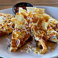 The Side Door Saloon - The best Prime rib quesadilla in the world. Filled with cheddar-jack cheese, ranchero sauce, black bean corn salsa and pico de gallo.