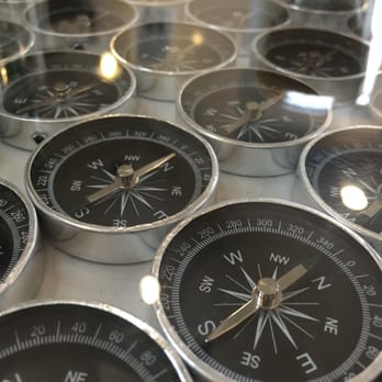 Ada's Technical Books and Cafe - Interesting table decor. This one had a bunch of compasses under the glass. - Bookstores Near Me - Seattle, Washington Ada's Technical Books and Cafe - Interesting table decor. This one had a bunch of compasses under the glass. - Bookstores Near Me - Seattle, Washington