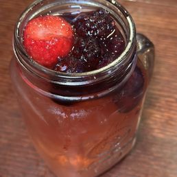 a jar of jam with two strawberries a jar of jam with two strawberries