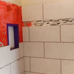 Household Services - Tub surround tile in process!