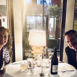 a man and a woman sitting at a table a man and a woman sitting at a table