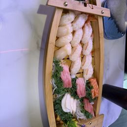 Assortment of ebi, scallop, sashimi, and eel