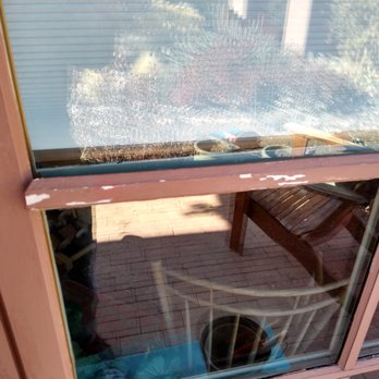 Sunwest Construction Specialties - Cheap muntins attached to exterior window with double-sided tape are warping away from the surface. - Windows Installation Near Me - Santa Fe, New Mexico