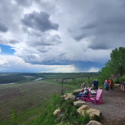Saskatoon Farm - The valley and clouds behind the farm