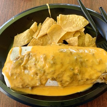 Tijuana Flats - Chicken tinga burrito with queso and salsa verde. - Mexican Near Me - Orlando, Florida