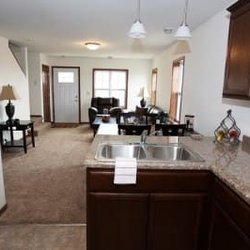 Tioga Townhomes - Looking into the living room - some units with a tv or dining table.