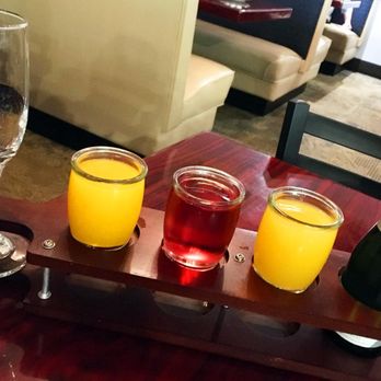 By Hand and Fork - Mimosa sampler. Lots of juice; only enough sparkling wine for two decent mimosas. Skip the flight; order a la carte. - American Near Me - Muncie, Indiana