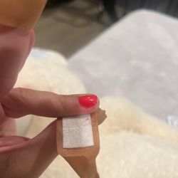 Blood on bandage and cut skin