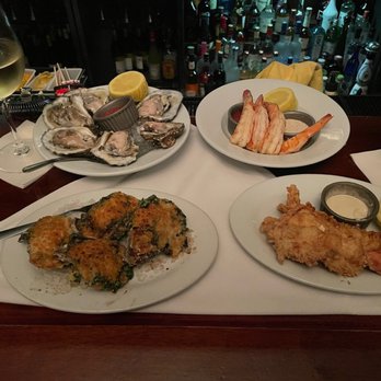 New York Prime - Oysters Rockefeller, Oysters on the Half Shell, Shrimp Cocktail, and a fried lobster tail with a glass of Far Niente Chardonnay - Steakhouses Near Me - Boca Raton, Florida New York Prime - Oysters Rockefeller, Oysters on the Half Shell, Shrimp Cocktail, and a fried lobster tail with a glass of Far Niente Chardonnay - Steakhouses Near Me - Boca Raton, Florida