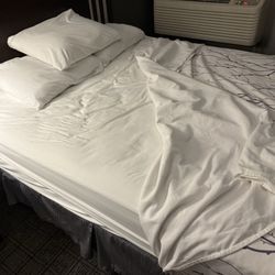 Eastland Suites - Unmade bed 1