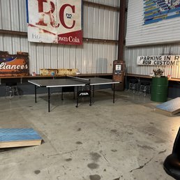 a ping pong table in a warehouse