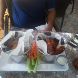Drafts Sports Bar & Grill - Garlic parmesan wigs and teriyaki wings served with fresh carrots and celery