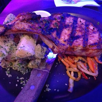 Travesias - Pork chop perfection! Juicy, tender and full of flavor!! - Latin American Near Me - Bronx, New York Travesias - Pork chop perfection! Juicy, tender and full of flavor!! - Latin American Near Me - Bronx, New York