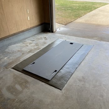 Flatsafe Tornado Shelters - a floor with a drain - General Contractors Near Me - Yukon, Oklahoma Flatsafe Tornado Shelters - a floor with a drain - General Contractors Near Me - Yukon, Oklahoma