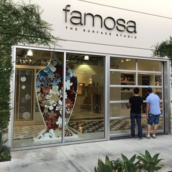 Famosa - two people standing outside of a store - Flooring Near Me - Costa Mesa, California