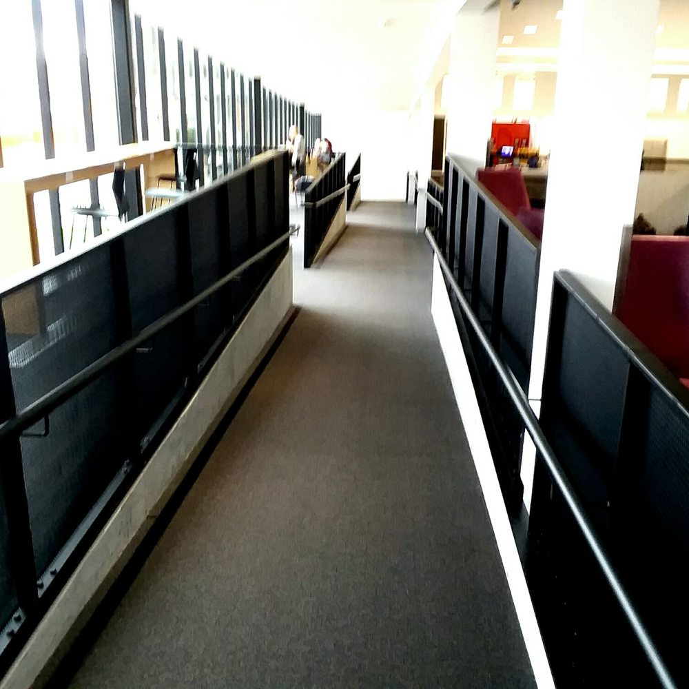 Columbus Metropolitan Library - Columbus - Ramp that follows street-side glass. - Libraries Near Me - Columbus, Ohio
